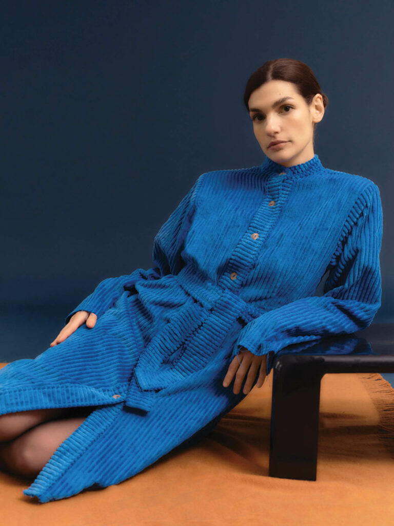 designer in a blue dress 